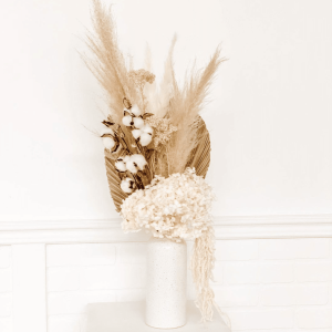 A wild and romantic mix of pampas grass, palm leaves, and dried blooms