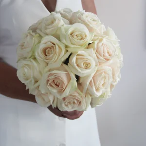 A classic all-white bouquet featuring premium fresh roses